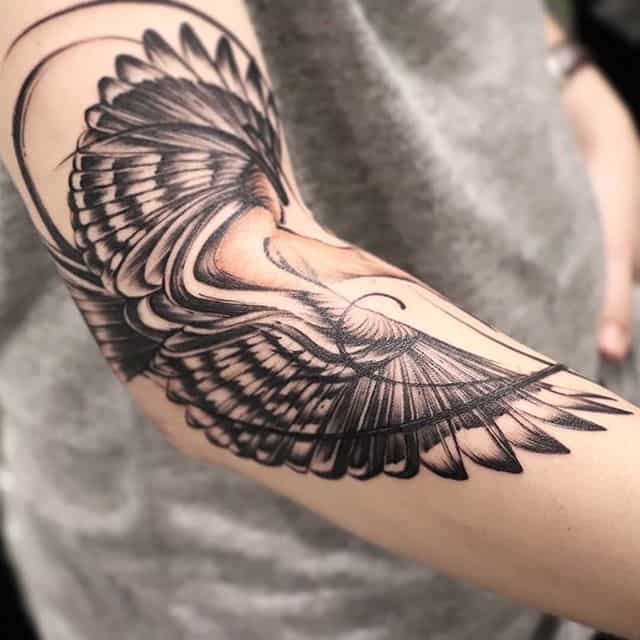 white dove tattoo on chest