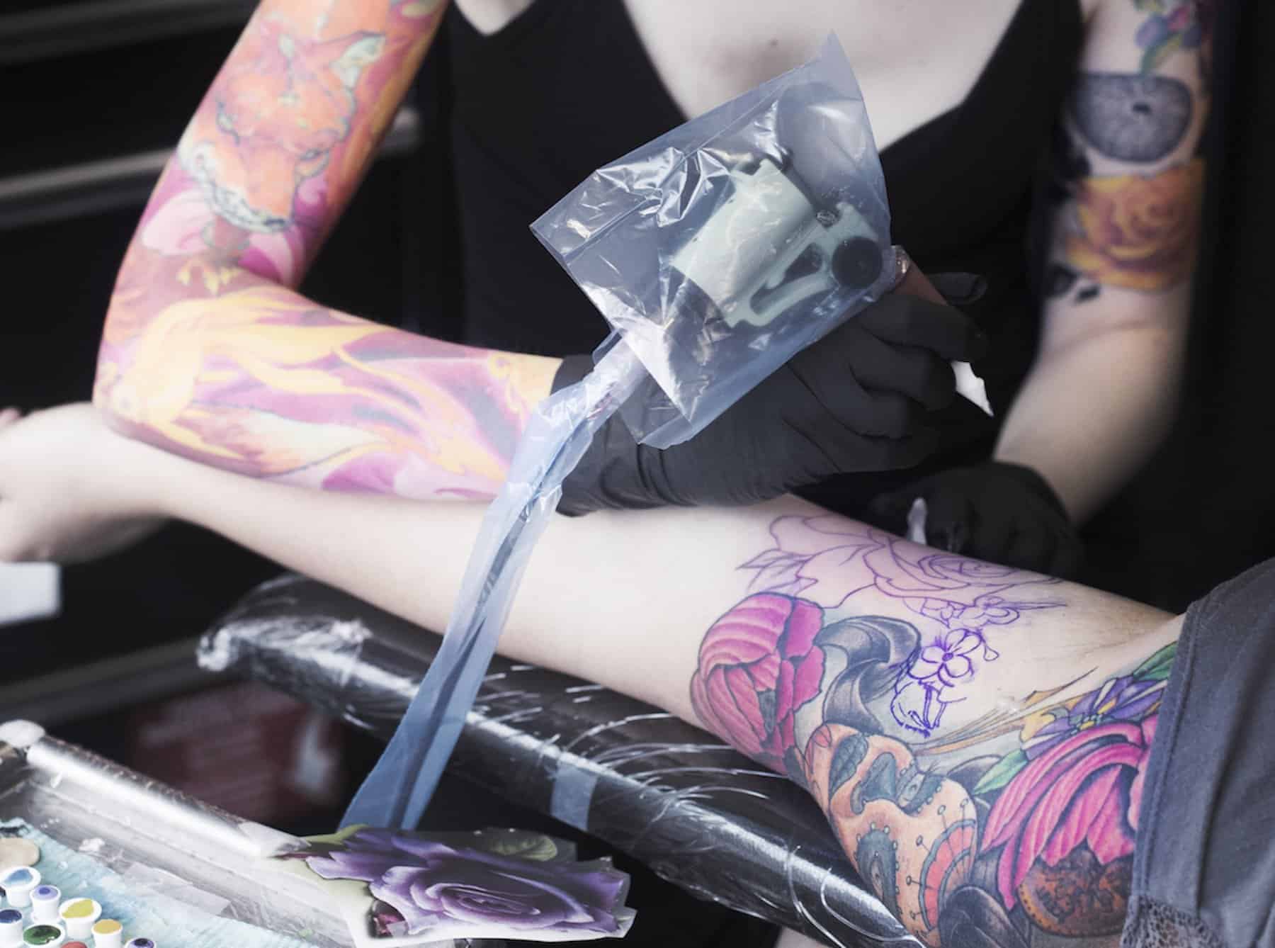 Can I Work Out With a New Piercing or Tattoo? Experts Weigh In